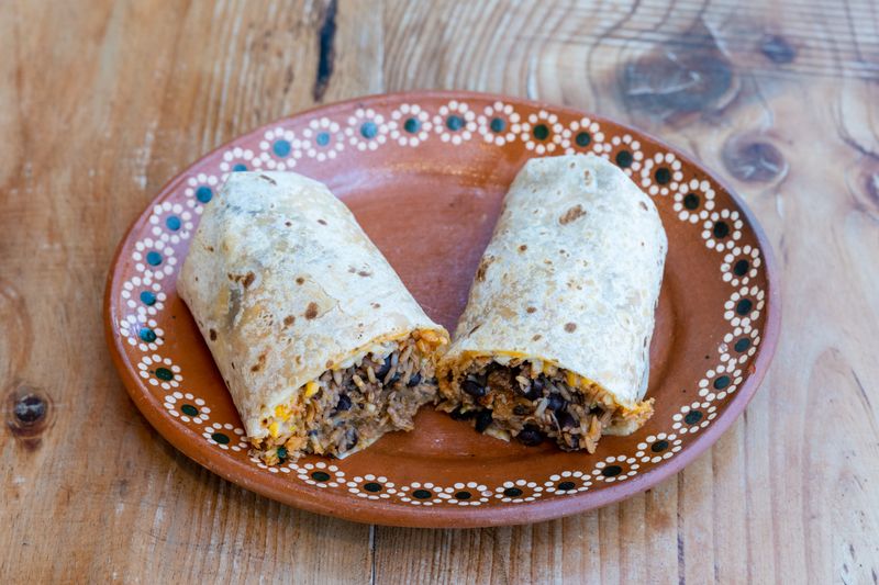 Guzman y Gomez Veggie Burrito with black beans and grilled vegetables